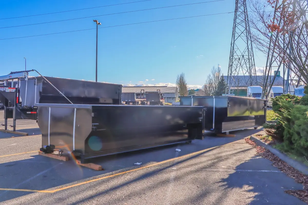 Roll-off dumpster ready for waste disposal at job site for 2 Yard Dumpster Rental in Hempstead